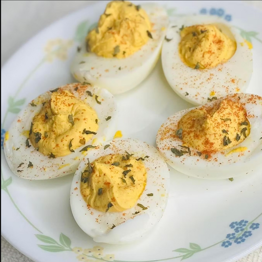 Deviled eggs on a decorative plate with a floral pattern